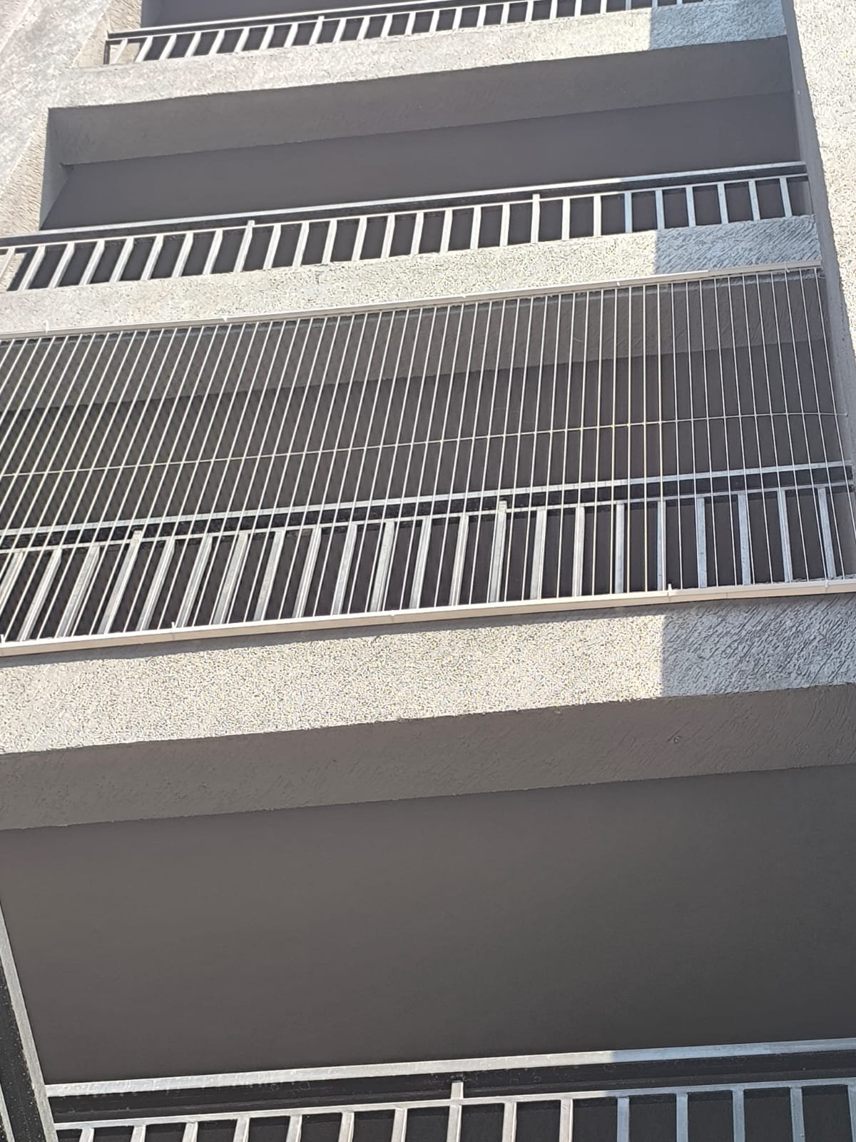 Exterior view of invisible grills installation